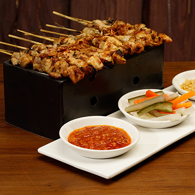 Taichan Satai served with Indonesian Sambal and Rice Cake
